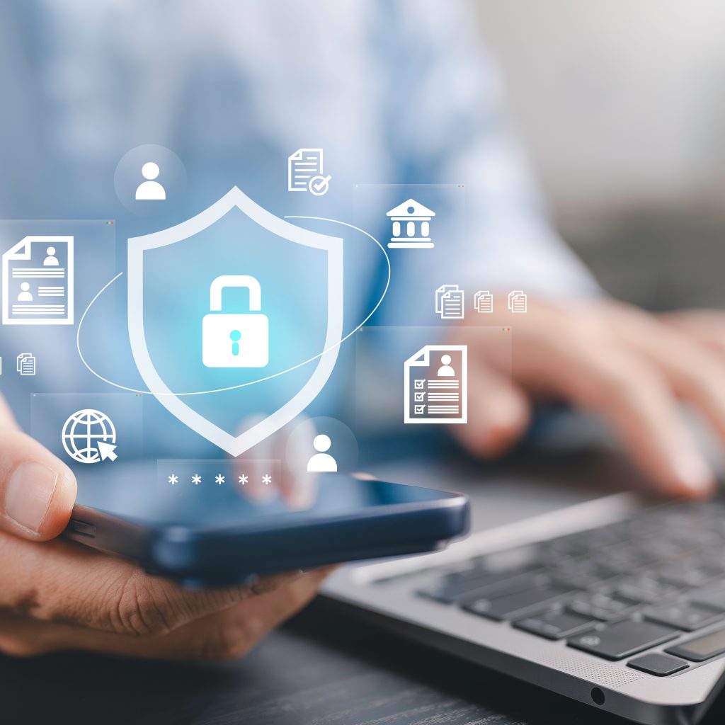 cyber security, personal data privacy protection, secure online banking, and encrypted digital transaction safety concept. businessman using smartphone and laptop with shield and padlock icons. cyber security, personal data privacy protection, secure online banking, and encrypted digital transaction safety concept. businessman using smartphone and laptop with shield and padlock icons.